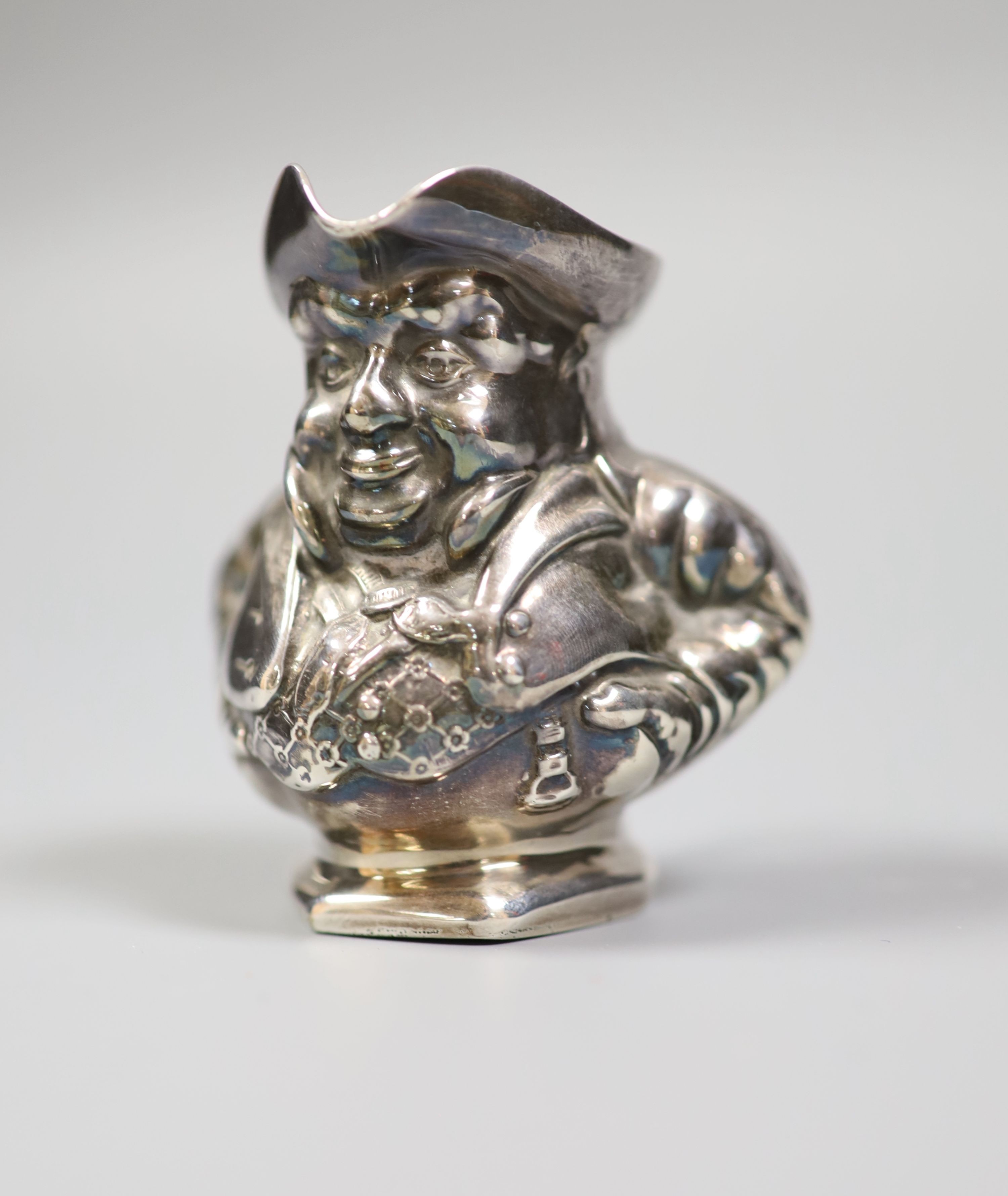 An Edwardian novelty silver cream jug modelled as a Toby jug, maker's mark rubbed, Birmingham, 1905, height 68mm.